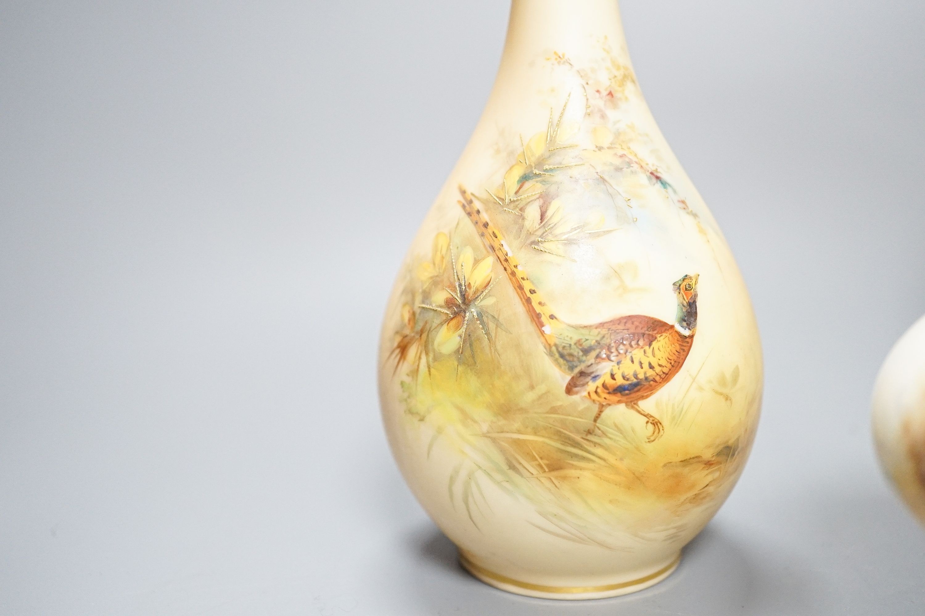 A Royal Worcester fruit painted small pot pourri and cover, 10.9cm high and a similar vase, 15cm, a Royal Worcester miniature cup and saucer, painted with pheasants, signed James Stinton and Grainger & Co pheasant vase